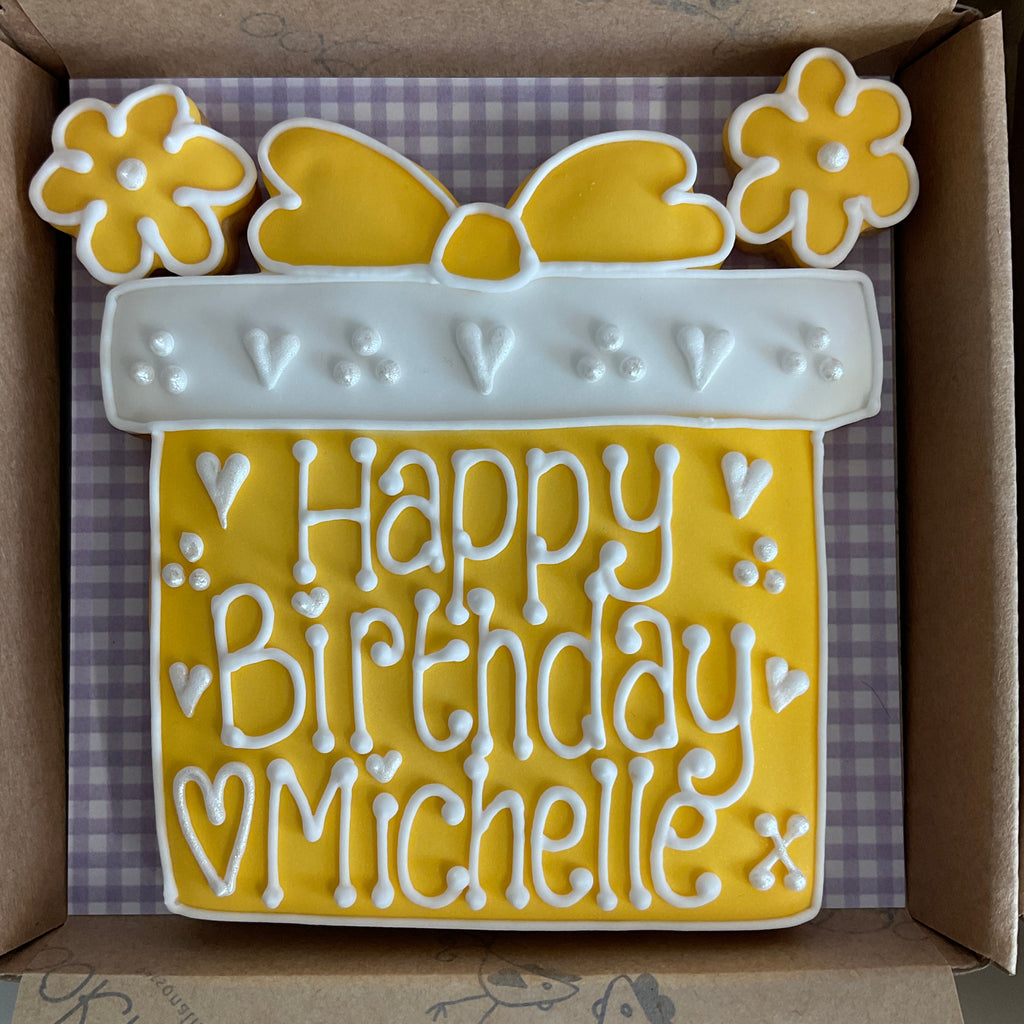 Yellow birthday present shaped personalised cookie