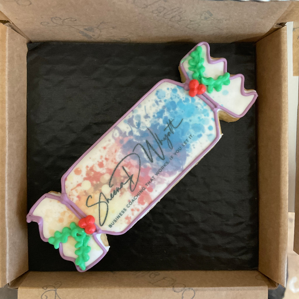 Delicious Christmas cracker cookie decorated with Royal icing and business logo