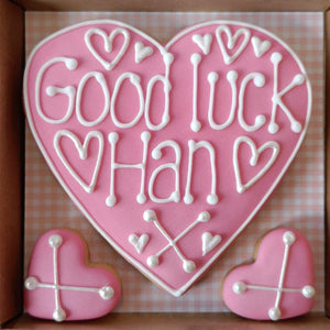 Good Luck heart shaped cookie box in pink icing